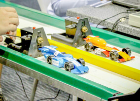F1 in Schools - Teams of students from all over Australia come together to compete in the F1 in Schools Technology challenge. Students design and build small but very fast versions of Formula 1 racing cars which hurtle down a 20m track at speeds of up to 80kmh. Teams compete in a variety of areas including racing the cars, oral presentations, marketing their product, gaining sponsorships and assembling their team display.